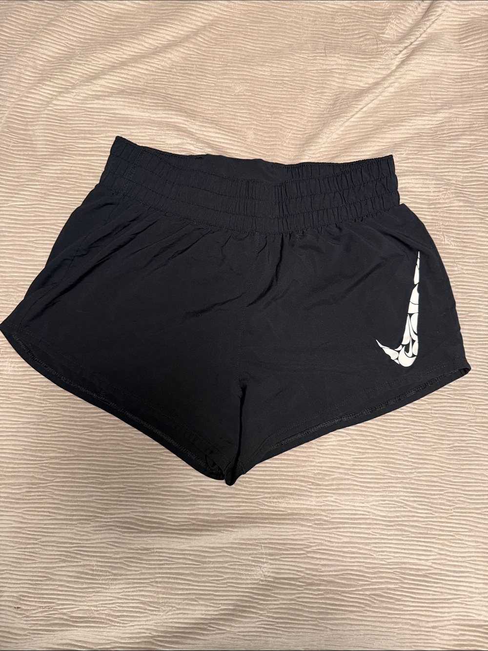 Nike Women’s Black Athletic Shorts with White Swoosh Accent